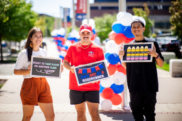 MSU Denver students holding up fall semester signs