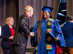 Lisa Johnson, 59, receives her Associate of General Studies degree on June 22, 2024, in the Tivoli Turnhalle. Photo by Alyson McClaran