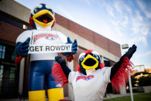 Rowdy mascot in front of Rowdy inflatable