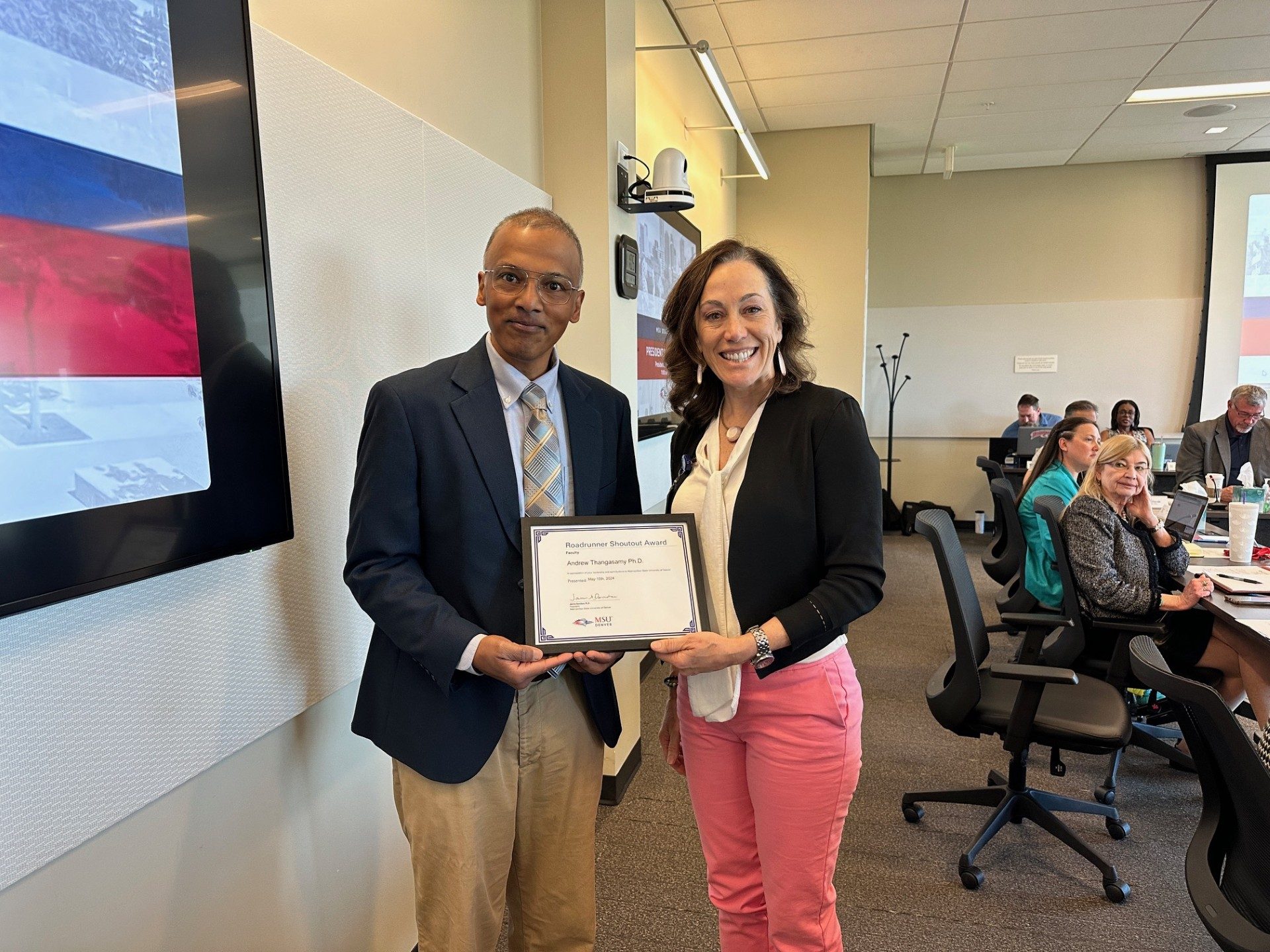 Professor Andrew Thangasamy receiving the Roadrunner Shoutout from President Davidson