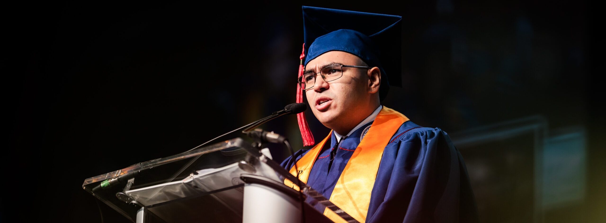 President's Award Recipient, Justin Guy, addressing his classmates while onstage at Commencement.