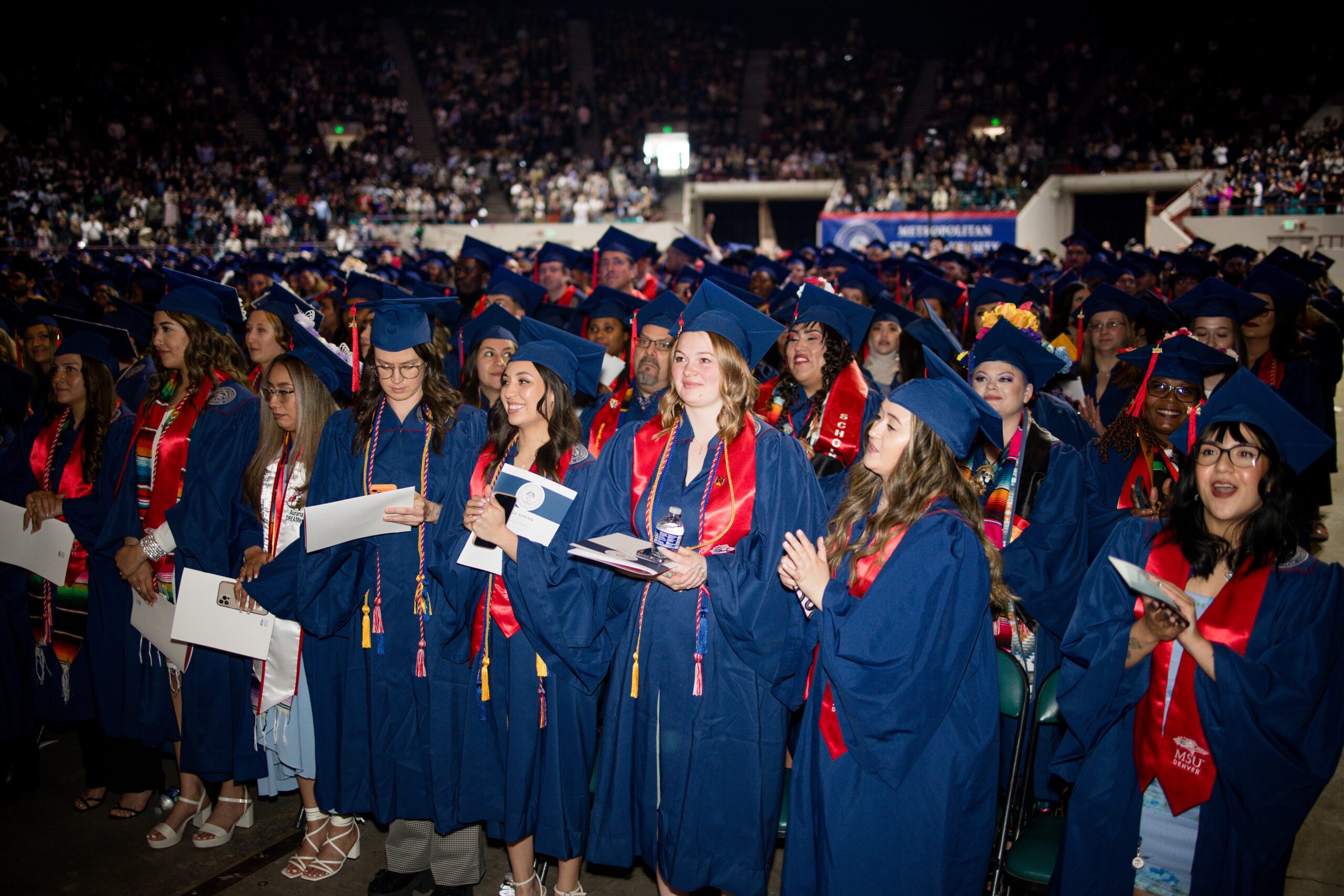 Graduates smile after they turned their tassels