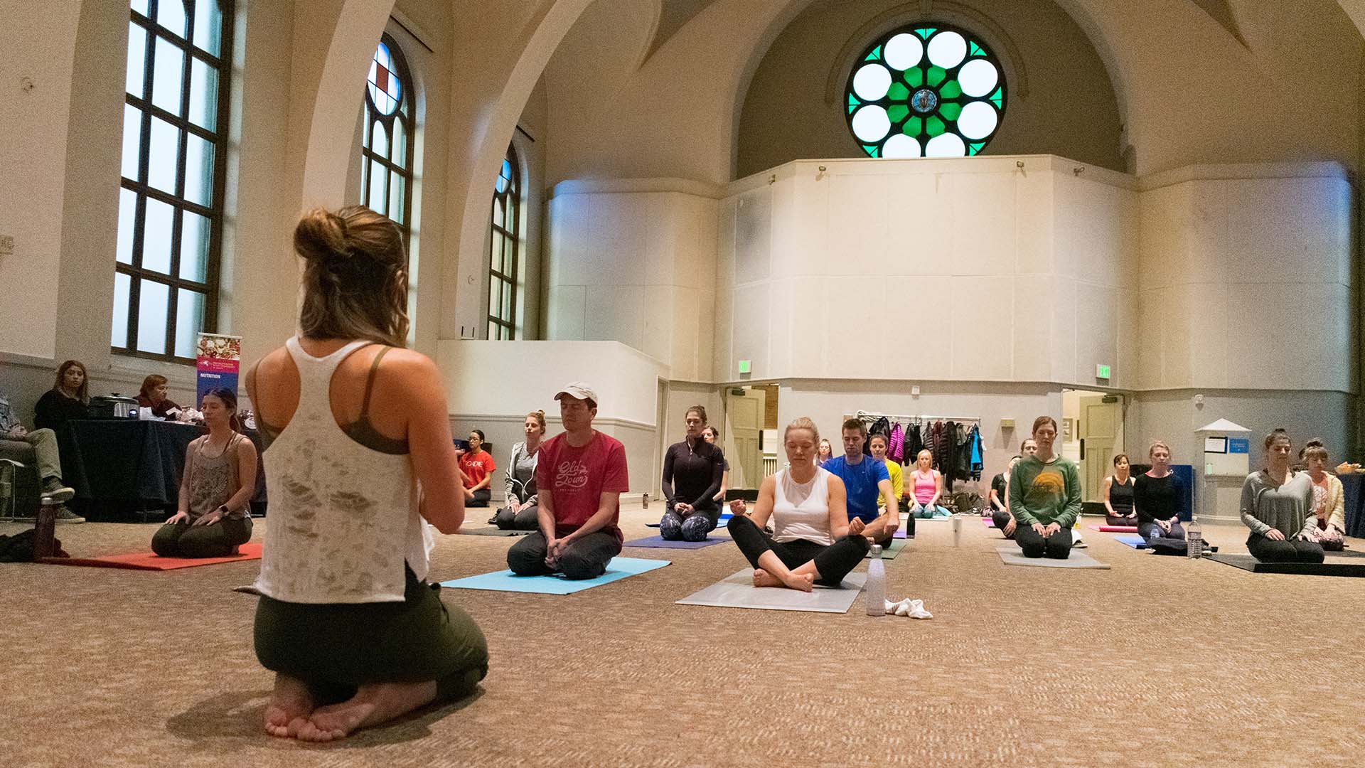 MSU Denver staff and students do yoga in St. Cajetans.