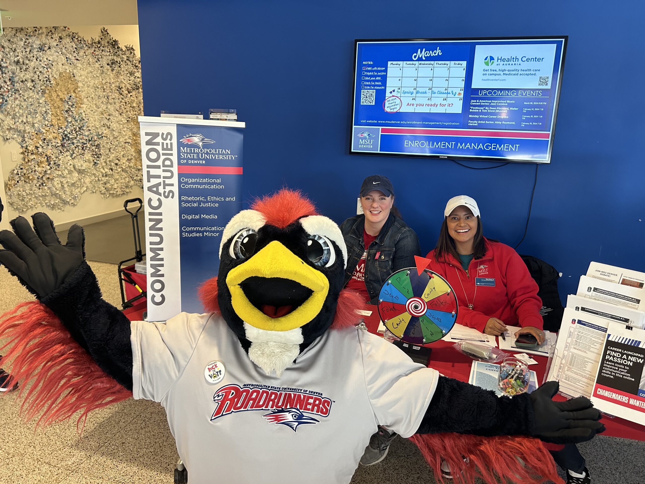 Rowdy the Roadrunner posing with Department of Communication Studies Professors