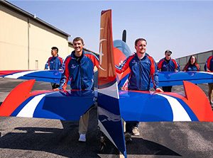 MSU Denver Aviation and Aerospace Science students pull the GameBird aerobatics plane to the runway. Photo by Josh Geurink