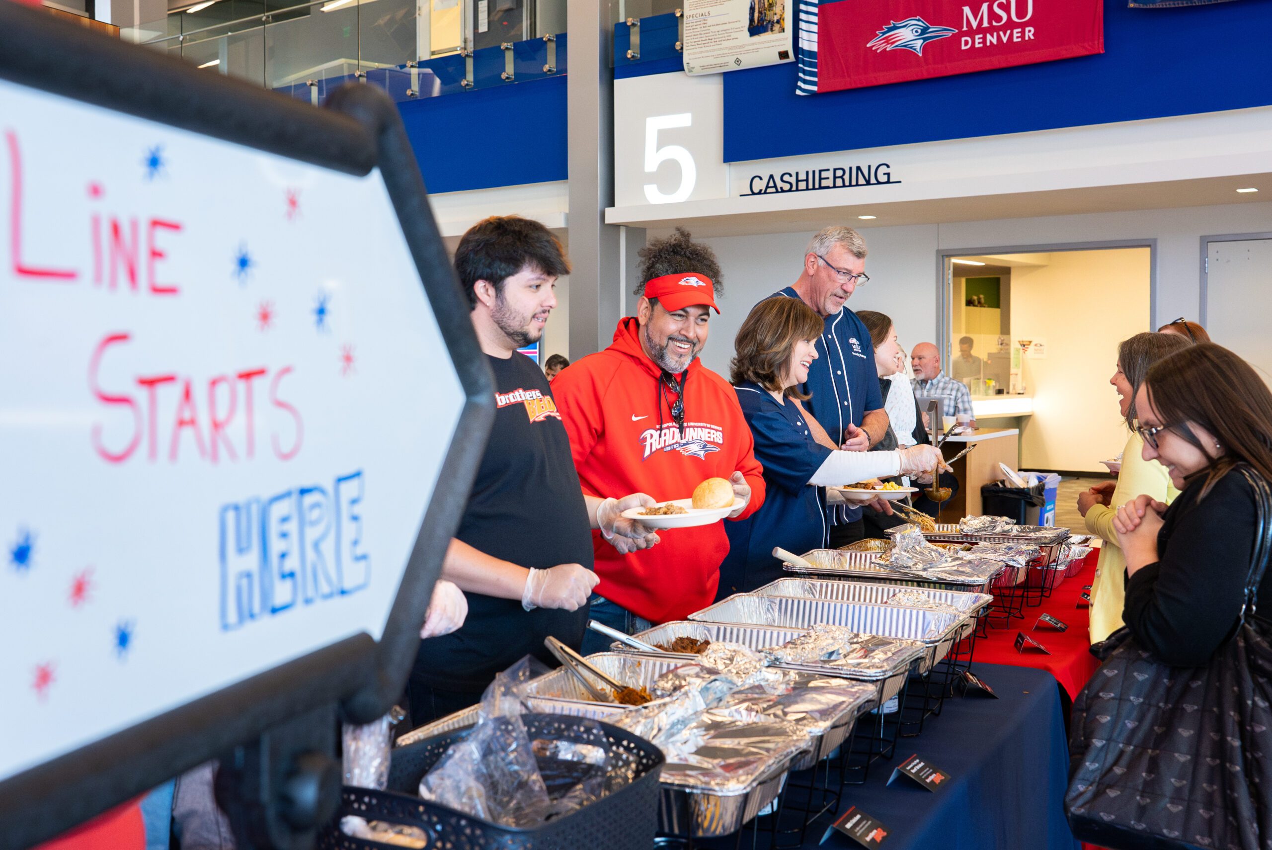 MSU Denver Senior leadership team serves food a the Faculty and Staff Appreciation BBQ