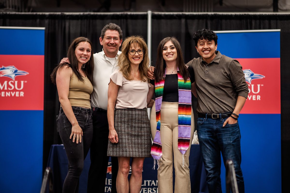 A student with with their family during LatinX graduation