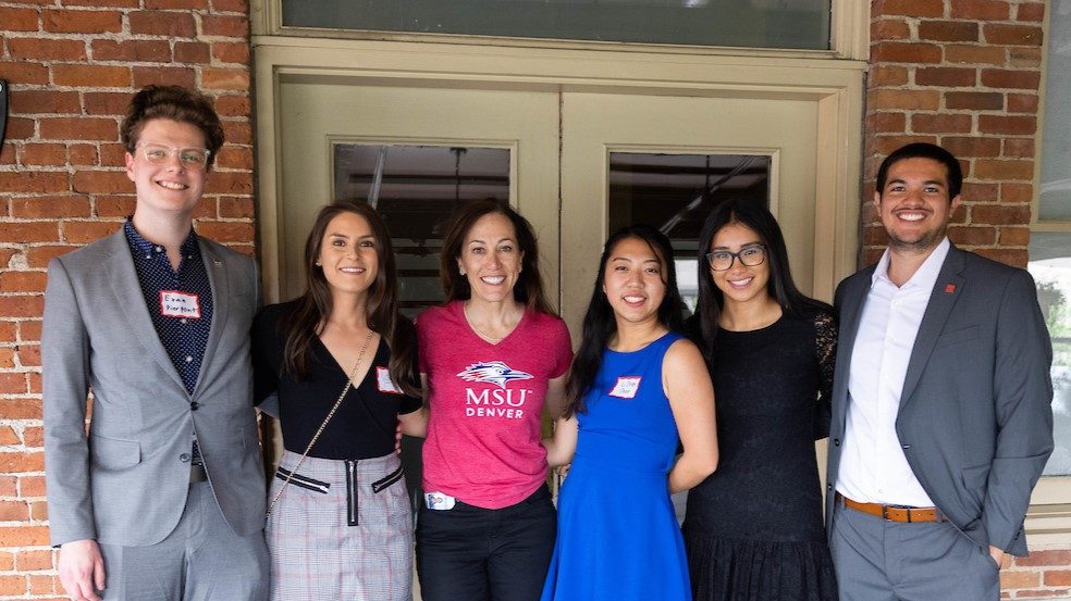 MSU Denver President Janine Davidson smiles with five students chosen for an internship in public service in Washington, DC