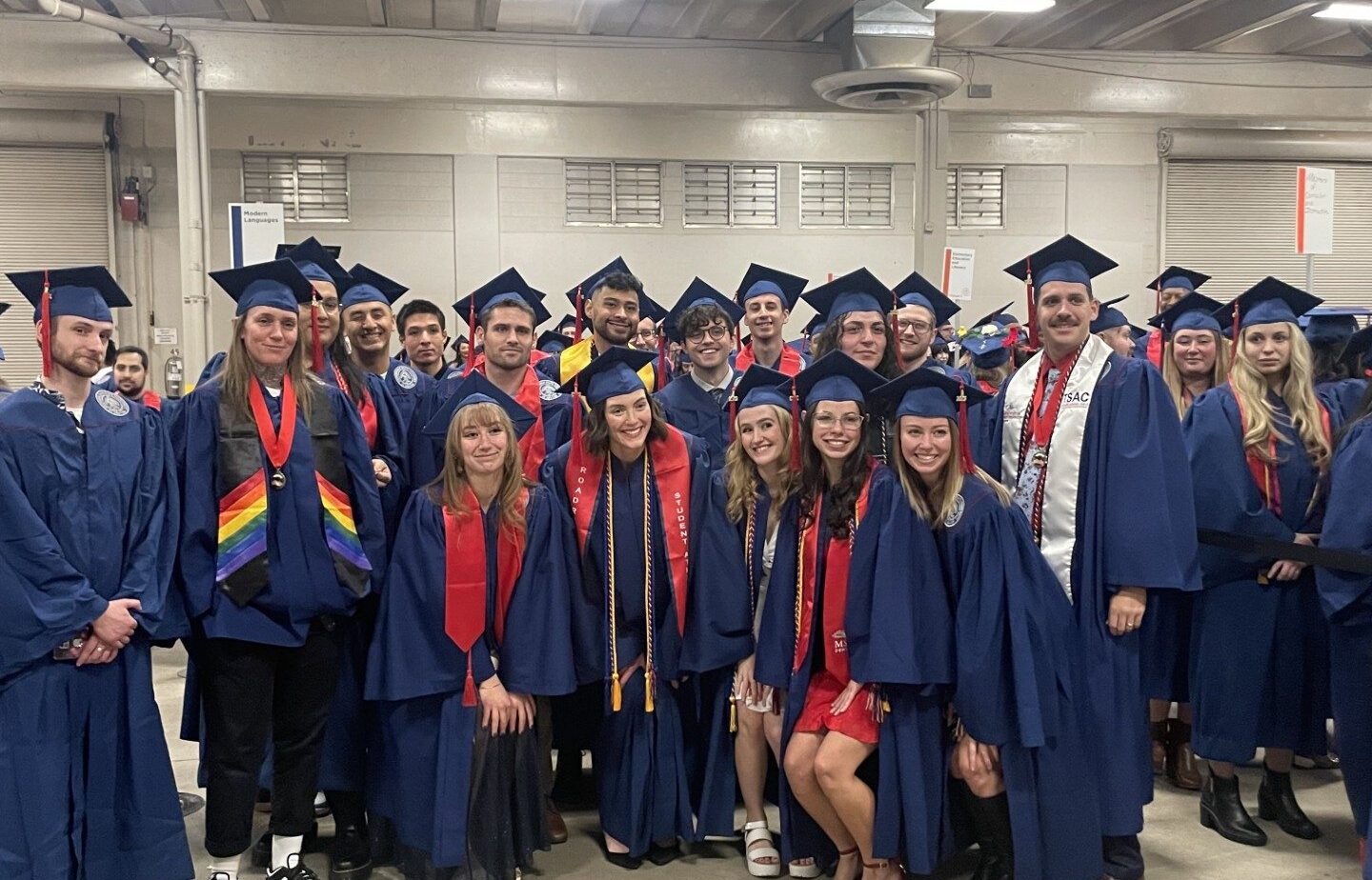 Journalism and Media Production graduates in cap and gown at MSU Denver Fall 2023 Commencement