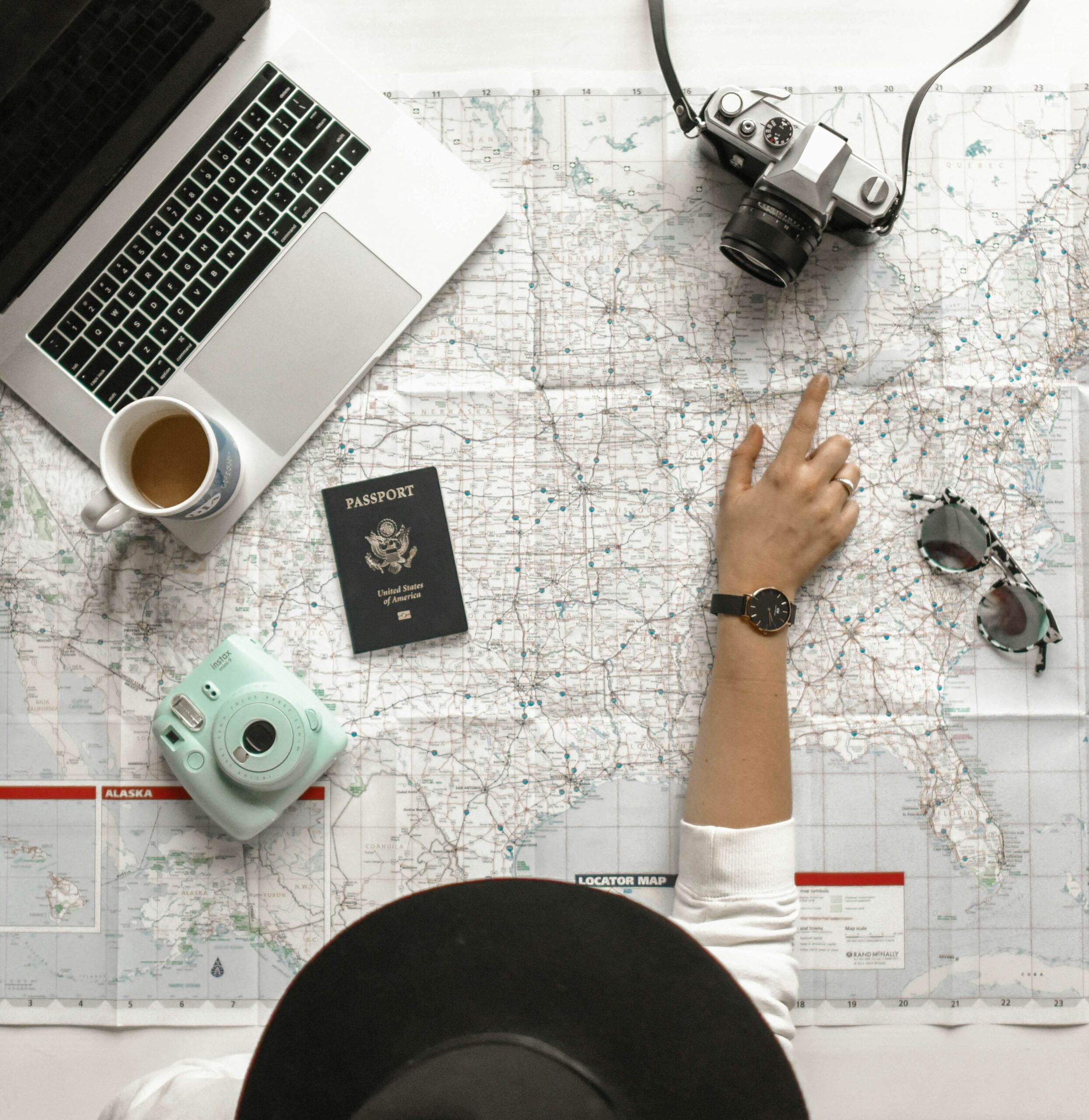 Travel items arranged on a desk