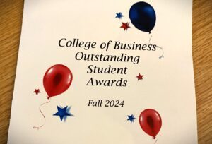 cropped image of CBUS Outstanding Student Awards Fall 2024 program, with red and blue ballons