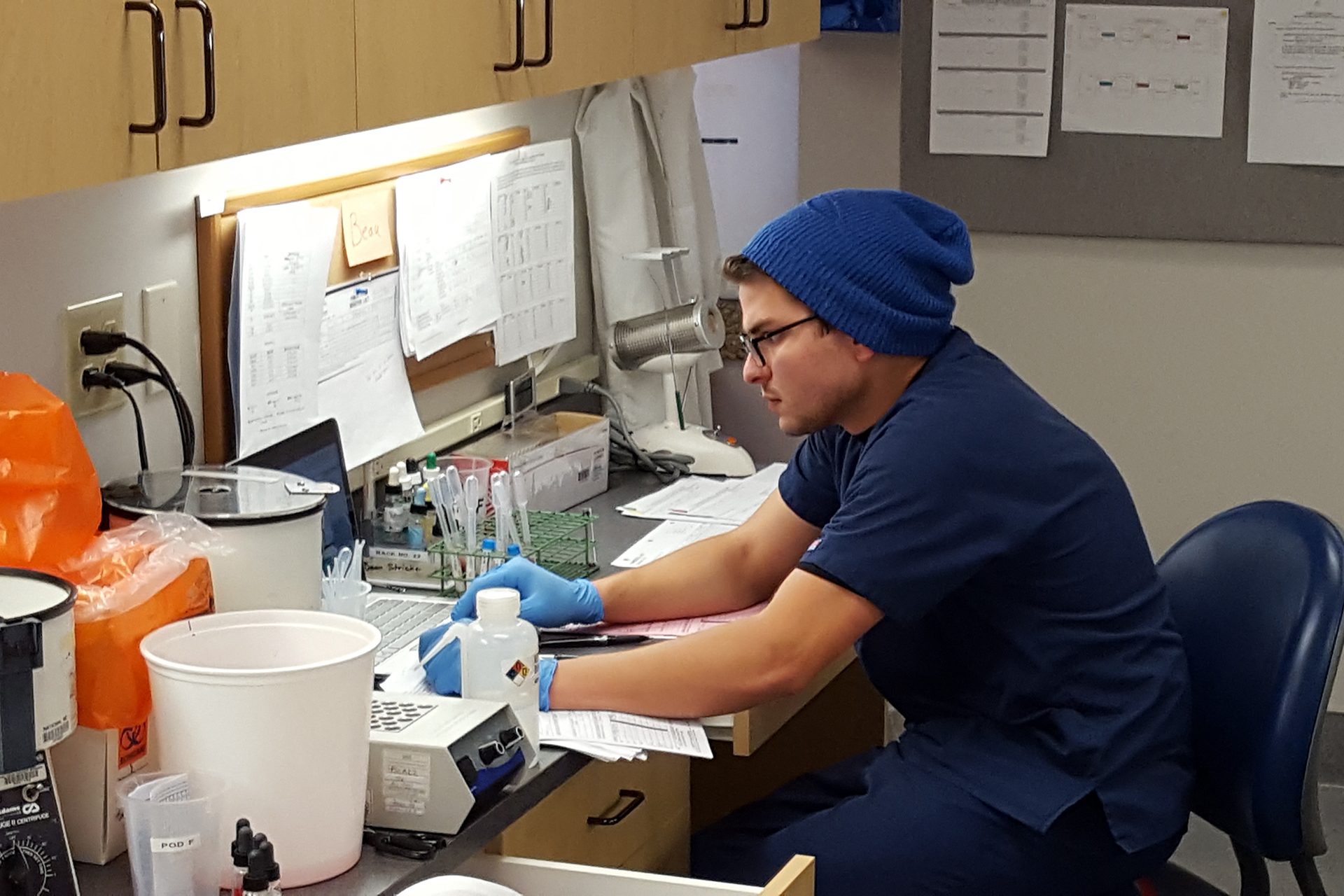 Male student working at lab station.