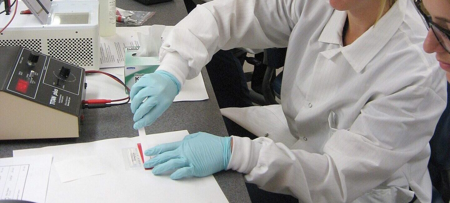 Woman running lab tests in classroom