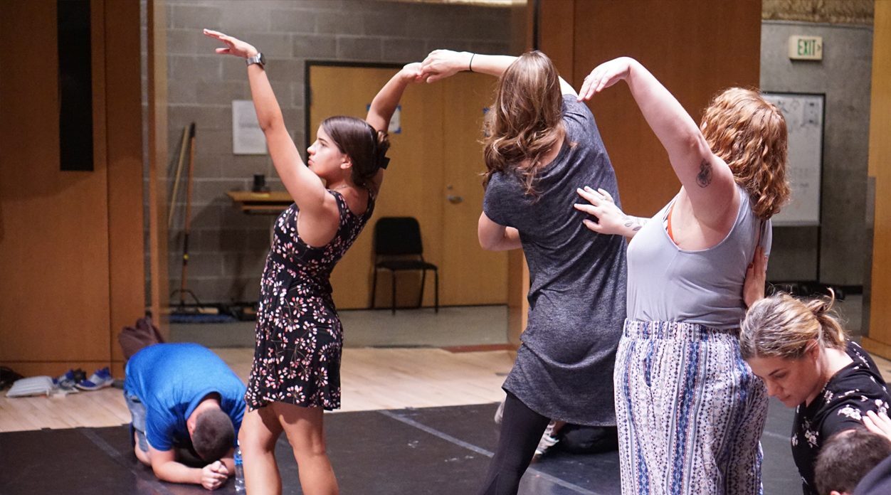 students dancing on a stage