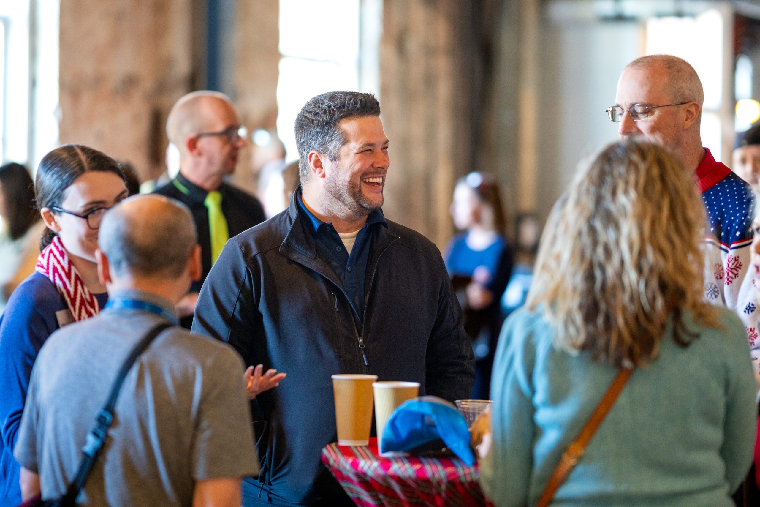 Staff and Faculty mingle at the 2024 Holiday Fest.